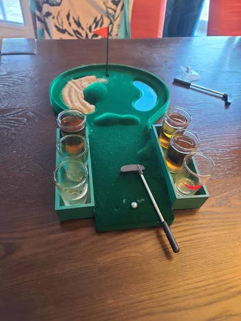 table mini golf with shot glasses