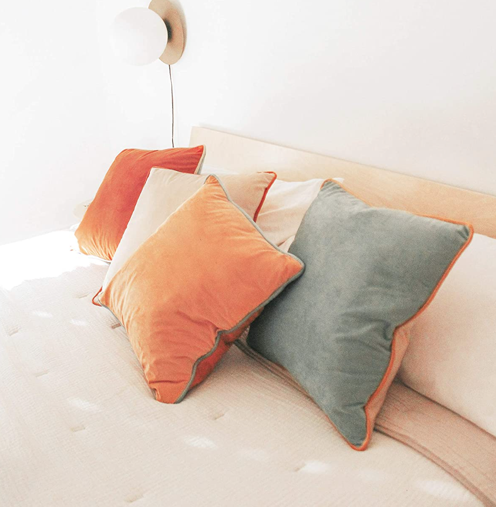 four pillows with contrasting piping color