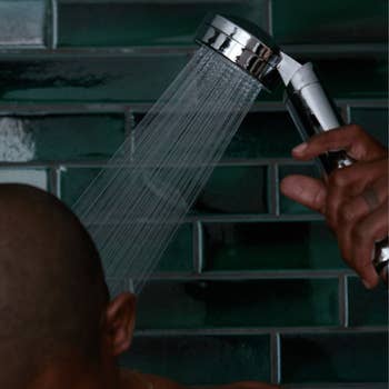a model using the shower head