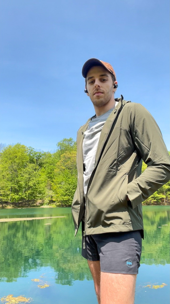 BuzzFeeder wearing the jacket in green