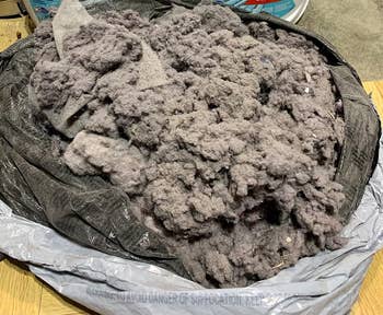 reviewer image of a garbage bag full of lint