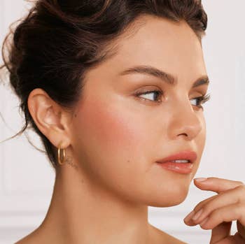Selena Gomez wearing Rare Beauty liquid blush