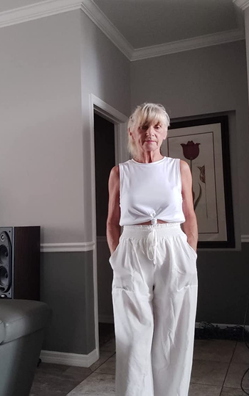reviewer photo wearing white linen pants