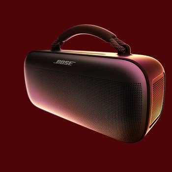 Portable Bluetooth talker  with a handle, designed by Bose, featured against a plain backdrop. Ideal for on-the-go audio experiences