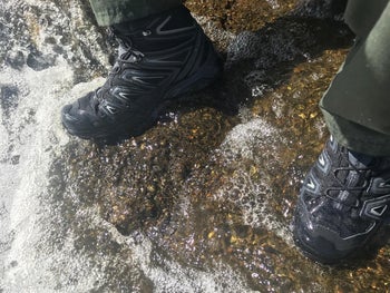 same reviewer's photo wearing the boots on wet rock