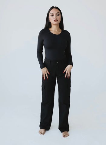 Model wearing the black cargo pants