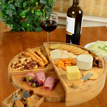 lifestyle image of charcuterie board with glass of wine