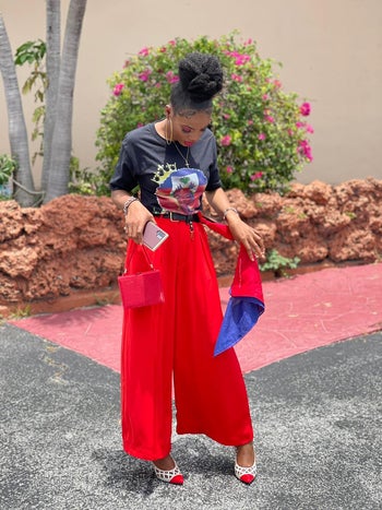 reviewer wearing the pants in bright red