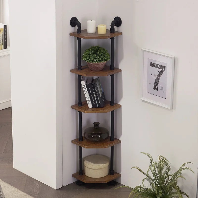 the slim wooden and metal corner shelf in the corner of a room