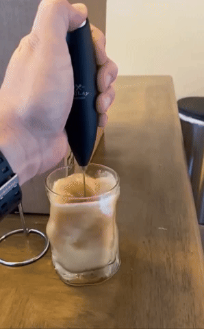 gif of another reviewer using it to froth the milk in their coffee
