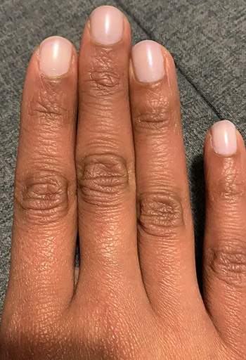 reviewer wearing the pale pink version