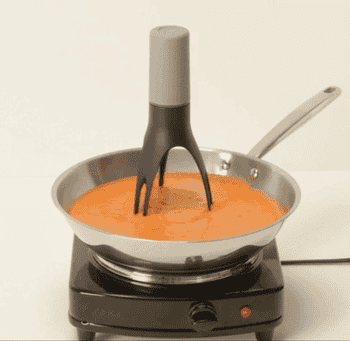 gif of saucepan on a hot plate with the automatic stirrer stirring the sauce