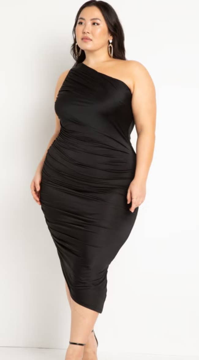 Person wearing an elegant, form-fitting one-shoulder dress, showcasing a chic benignant suitable for ceremonial occasions oregon manner events