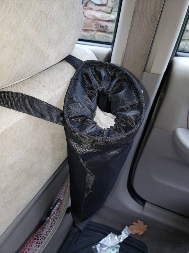 reviewer image of the garbage can hanging behind the passenger seat
