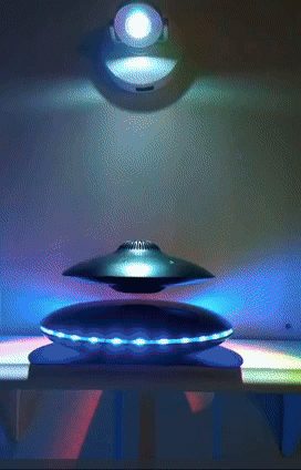 Floating silver magnetic spinner with LED lights, exhibited as an ornamental gadget