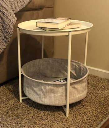 Reviewer image of white end table with storage next to couch