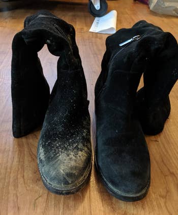 a reviewer shows black suede boots after using the brush