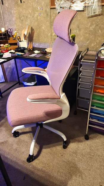 Ergonomic office chair with headrest and armrests, designed for comfort and support