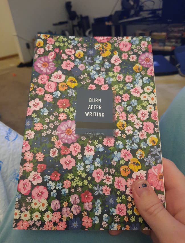 Person holding the publication