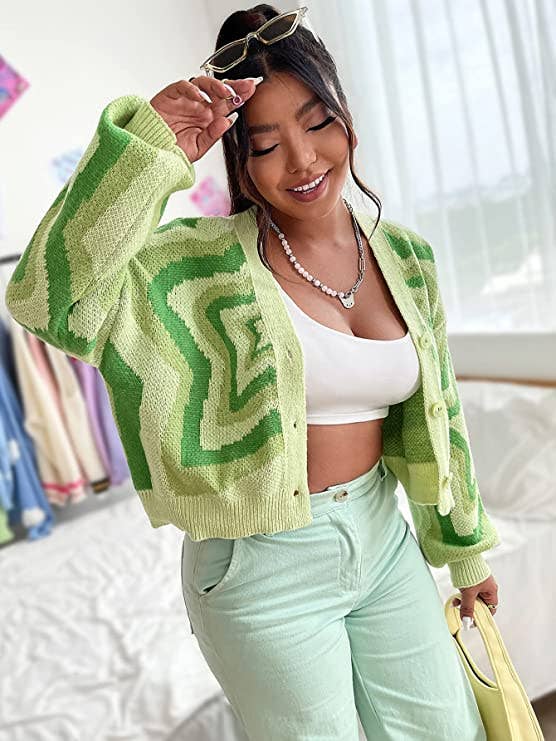 model wearing green patterned cardigan