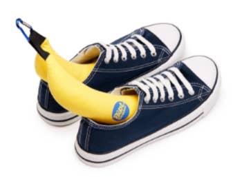 the boot bananas in a pair of white and blue sneakers