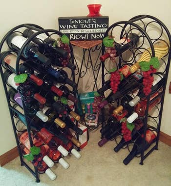 Reviewer image of two of the black freestanding wine racks