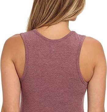model wearing a racer-back tank and their bra straps are not showing