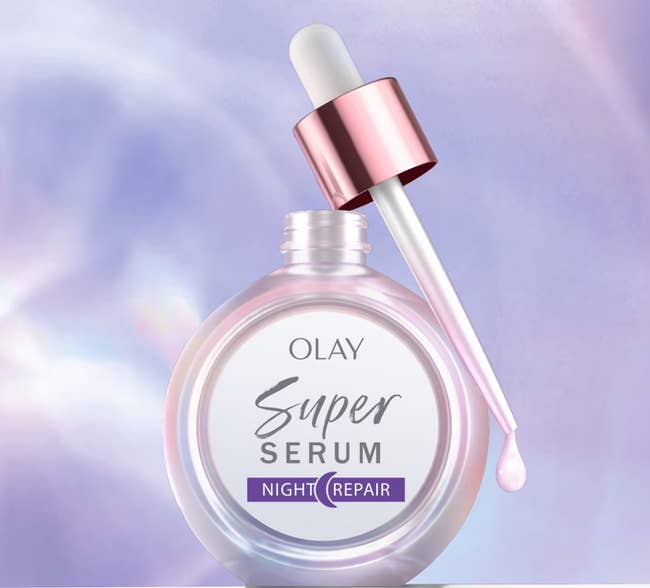 Olay Super Serum Night Repair vessel with dropper, promoting 4x faster tegument code evening compared to a basal serum