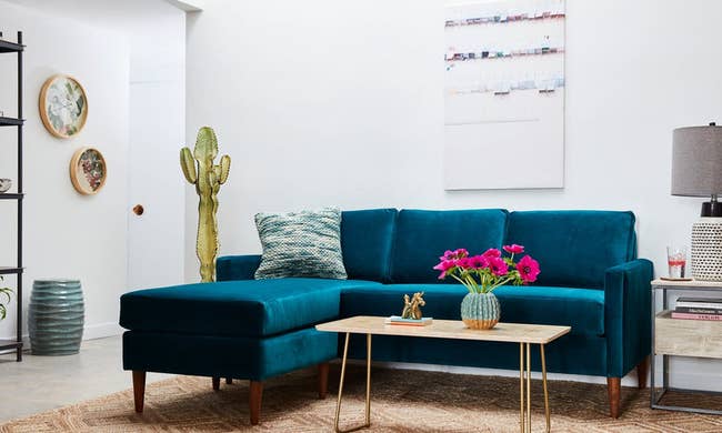 lifestyle photo of blue velvet sectional couch