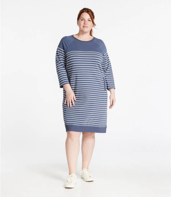 model wearing blue and white striped sweatshirt dress
