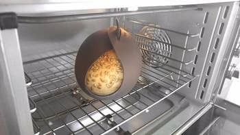 The same reviewer's dough now cooked in the container in the oven