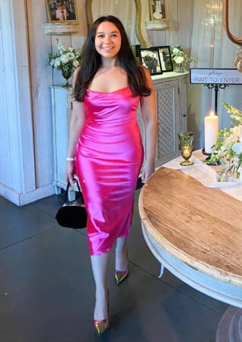 Reviewer wearing pink dress