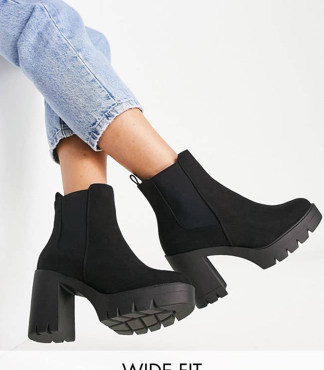 model wearing a pair of black chunky booties