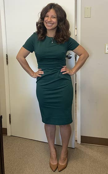 Image of reviewer wearing green dress