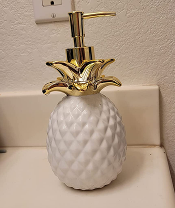 Reviewer image of the white pineapple soap dispenser 