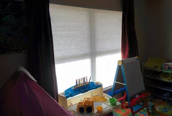 reviewer's photo of the cordless blinds in a kids' room