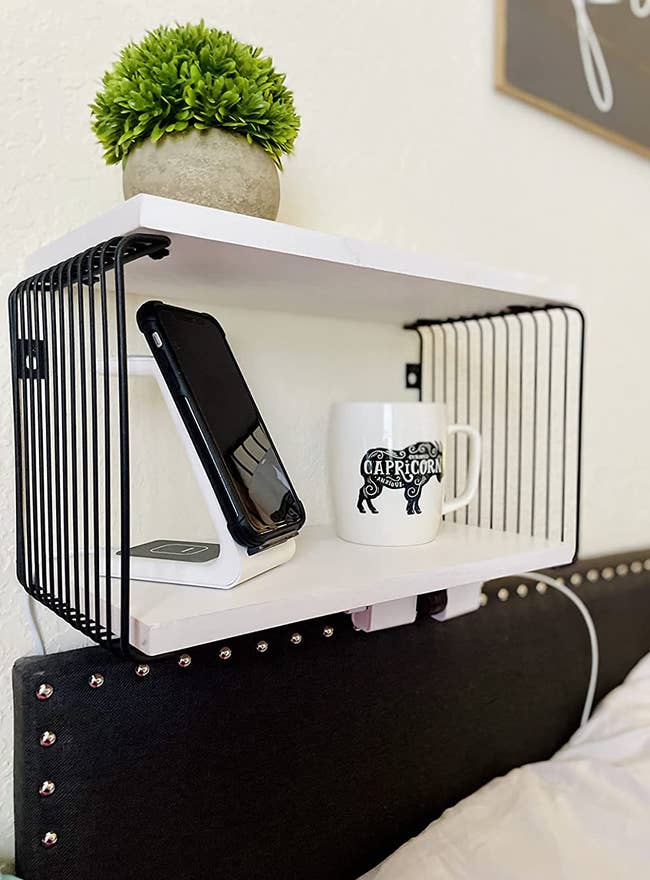 reviewer photo of floating nightstand mounted above a headboard