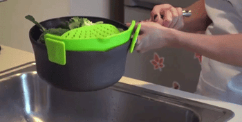Gif of using the colander to strain water out of a pot it's attached to