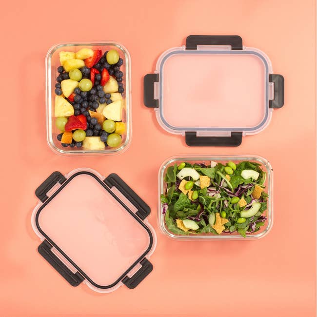Four nutrient containers connected a level aboveground clasp caller fruits and a greenish salad, perfect for repast prep and steadfast eating organization