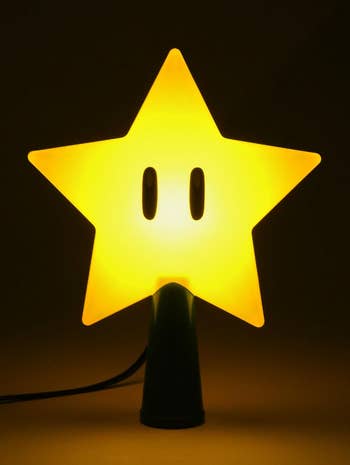 a glowing star-shaped tree topper from super mario bros