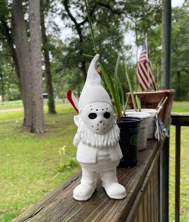jason garden gnome on outdoor deck