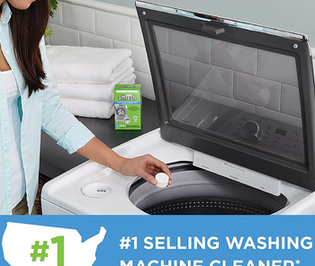 a model dropping a cleaning tablet into a washing machine