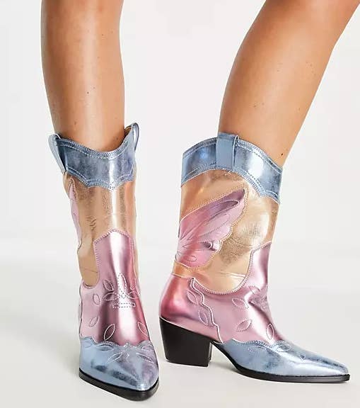 model in metallic blue gold and pink cowboy boots