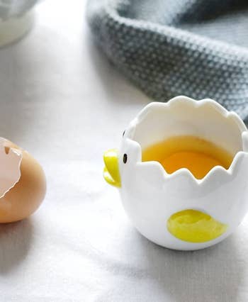 chicken and egg anthropomorphized dish with egg inside 'cracked' top