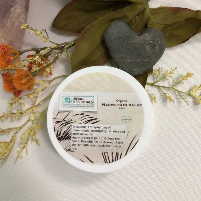 Container of organic nerve pain salve
