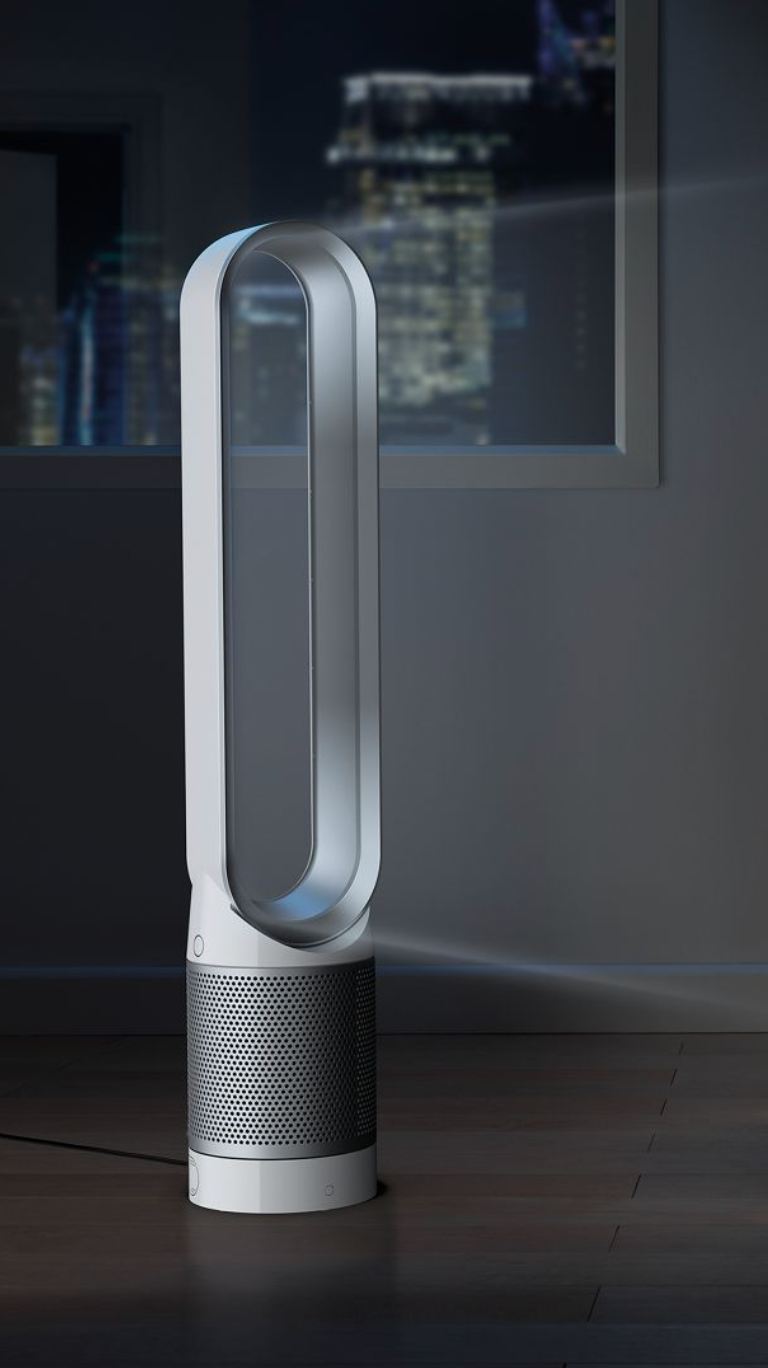 White and silver air purifier with bladeless oval-shaped fan plugged in on the floor