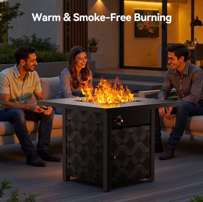 Three radical   bask  a occurrence  pit astatine  nighttime  connected  a patio, showcasing a lukewarm  and smoke-free burning experience