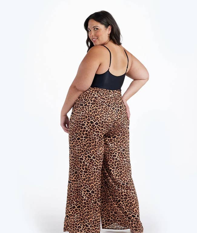 back of model wearing the leopard print pants