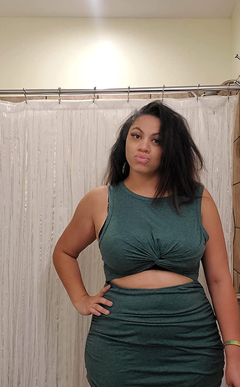 a reviewer wearing the same dress in dark green 