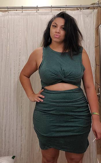 a reviewer wearing the same dress in dark green 